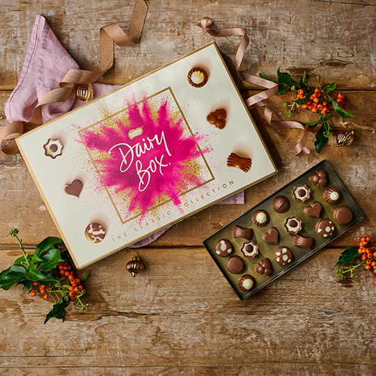 Dairy Box Chocolate selection on a christmas background