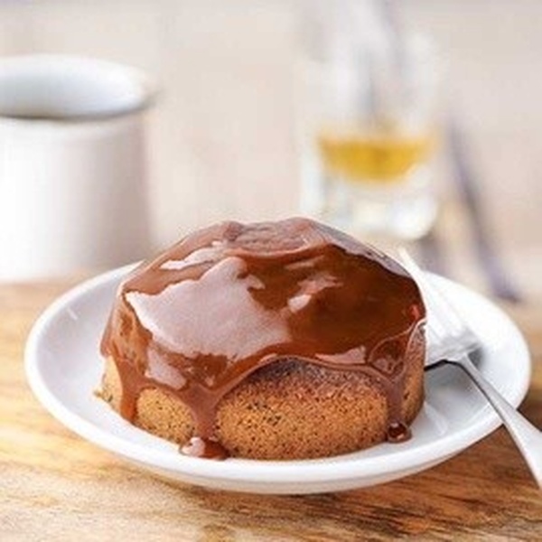 A sponge pudding topped with sticky toffee sauce