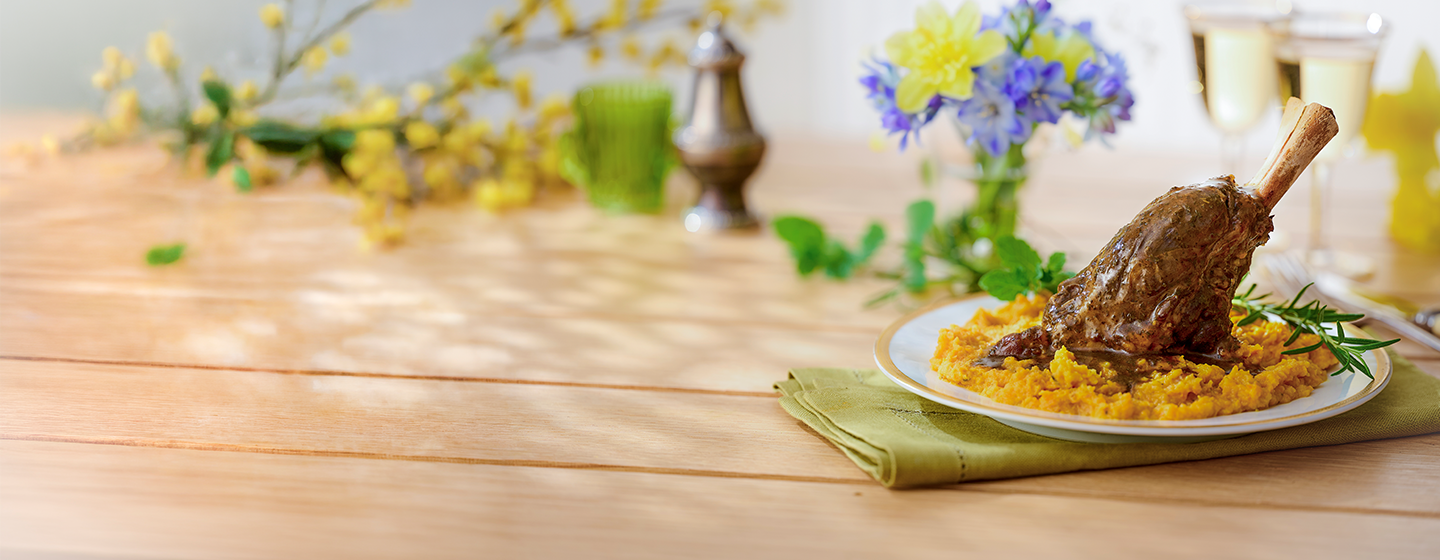 An image of a lamb shank on carrot & swede crush