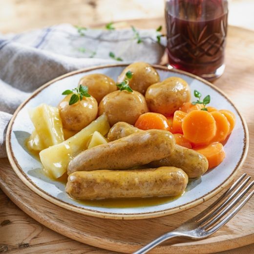 An Image of pasta with meatballs on a table